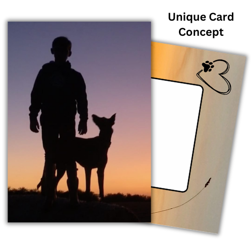 The image shows the front of the Bare Cards Dog Photo Sentiment Card 'I've got you' showing a silhouette of a boy with his dog looking up at him on a sunset background. Behind is an image of the Bare Cards Built-in Envelope front, with sunset and a white rectangle to write address. There is a black heart outline with a dog paw and a single ear of corn silhouetted against the sunset. The caption reads 'Unique Card Concept'
