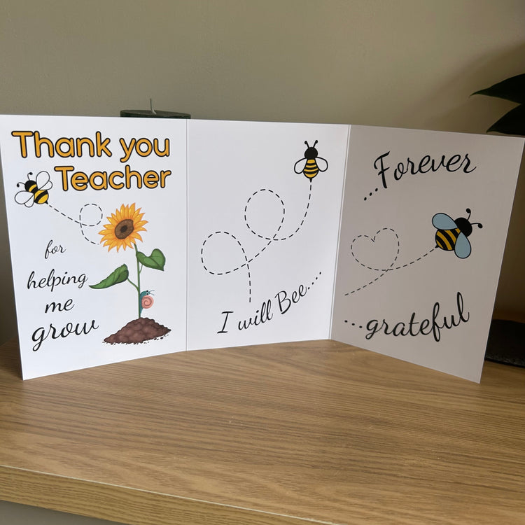 The photo shows the three pages of the trifold Thank You teacher card from Bare Cards depicting a sunflower and bee and the caption "Thanks you teacher for helping me grow. I will bee forever grateful".