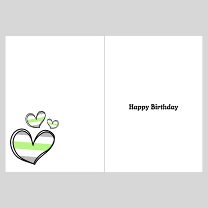 Greeting card with Agender heart designs and 'Happy Birthday' text on a gray background