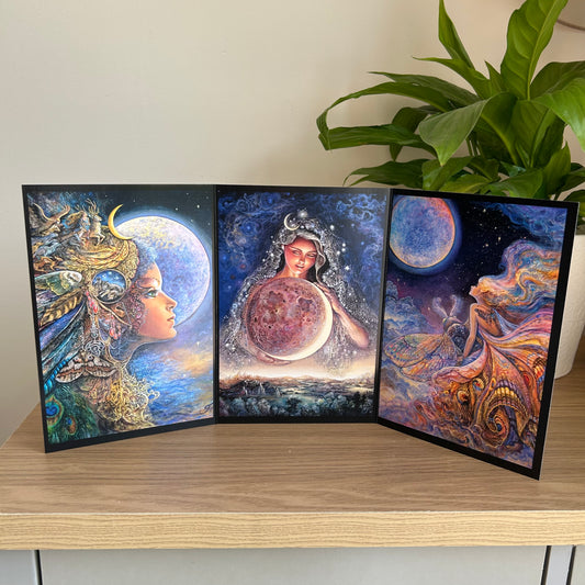 Three-panel self-sealing greetings card UK with artistic fantasy designs featuring Josephine Wall paintings of the moon goddess Diana and mystical moon paintings on a wooden surface