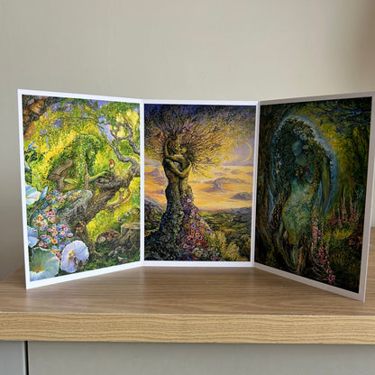 Three-panel self-sealing greetings card UK with artistic fantasy designs of nature figures on a wooden surface.