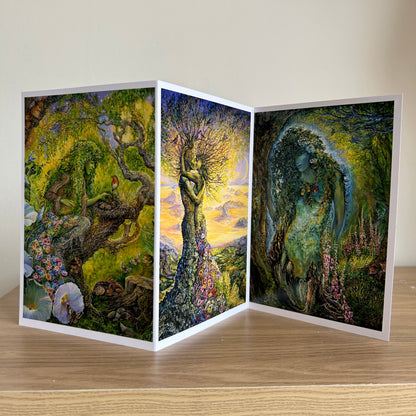 Three-panel self-sealing greetings card UK with artistic fantasy designs of nature figures on a wooden surface.