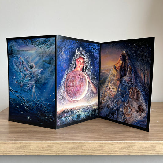 Three-panel self-sealing greetings card UK with artistic fantasy designs featuring Josephine Wall paintings of the moon and mystical fairies and goddesses on a wooden surface