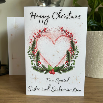 Christmas card with heart design and text on a wooden surface