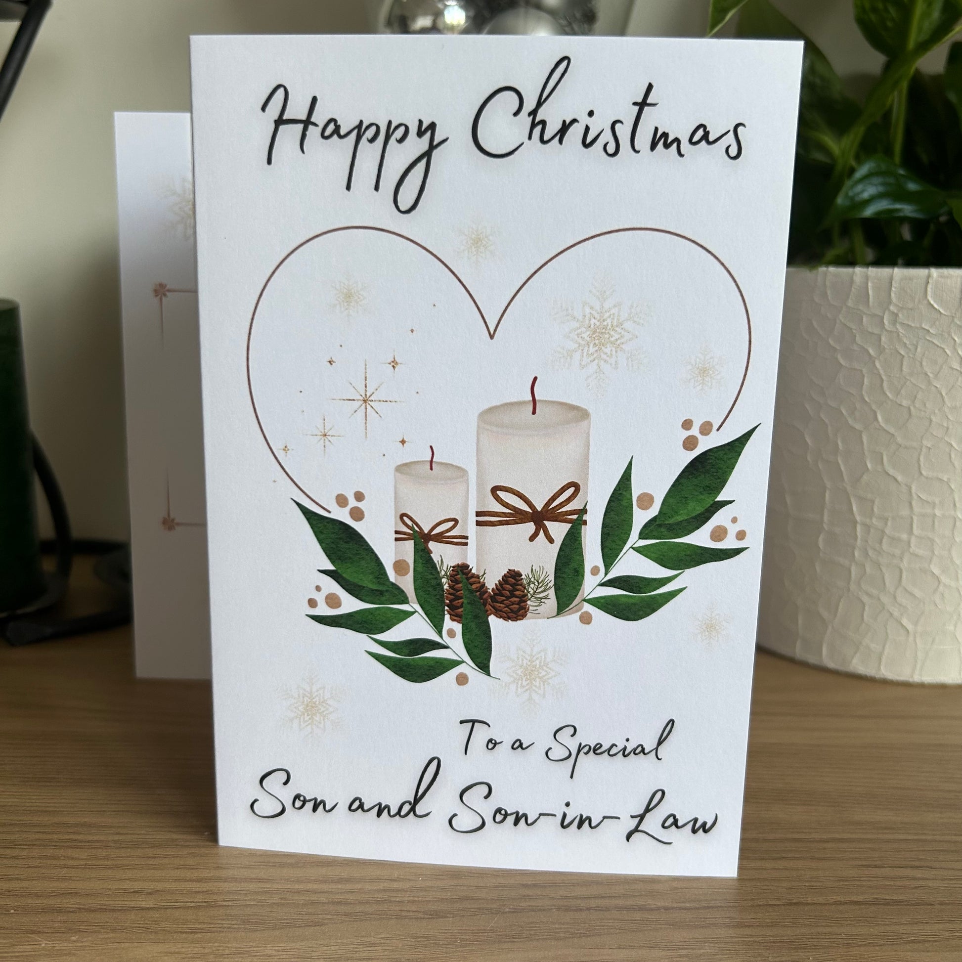 Christmas card with candles and greenery for a special son and son-in-law