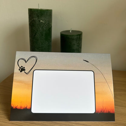 The image is a photo of the  front of the Bare Cards envelope pages for the Dependable Friends Trifold Photographic Dog Range depicting a silhouette of a field on a sunset background. 