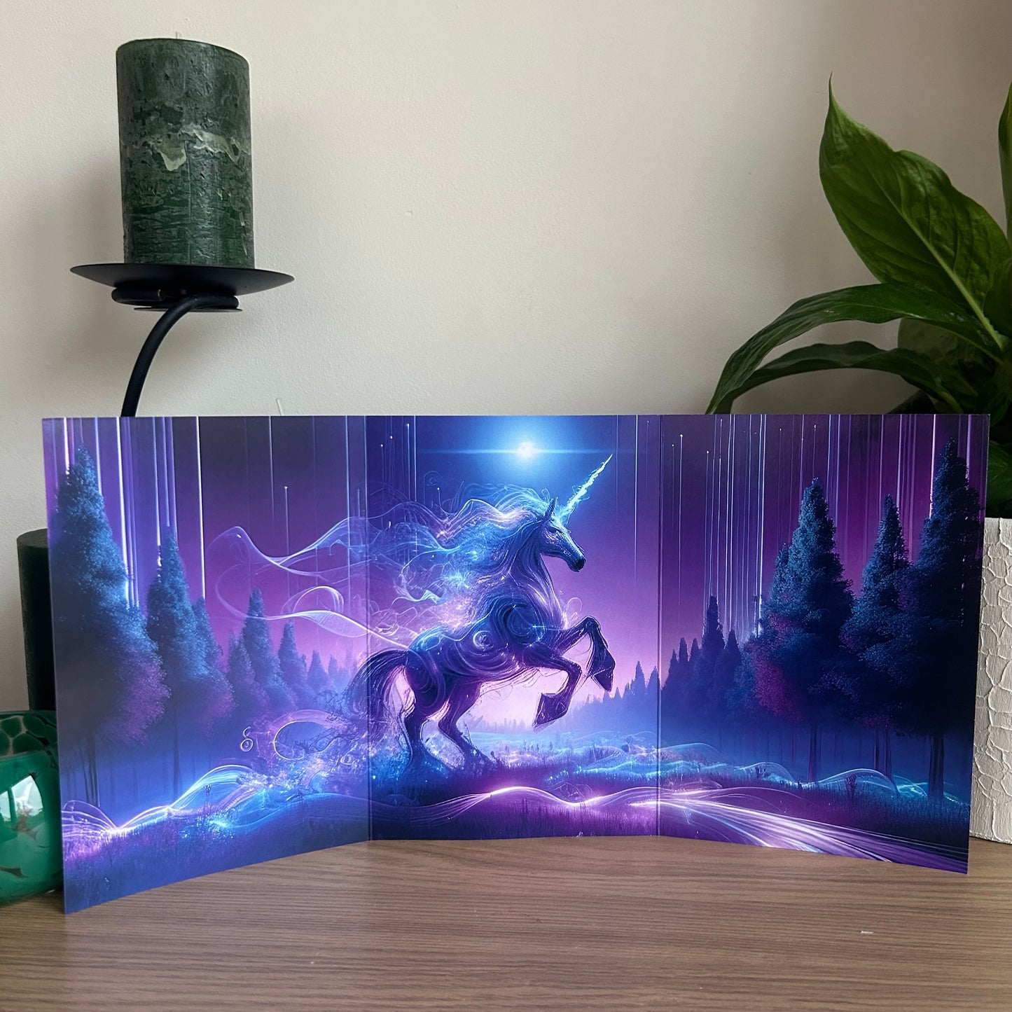 Unicorn in a fantasy landscape with purple and blue hues on a decorative panel.