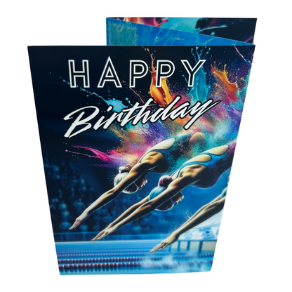 Trifold Female Swimming Birthday Card from the Push the Limit Range. Image shows the folded card depicting front with three female swimmers diving into a laned competition pool whilst audience watches and a background of colouful paint splatters. The caption reads 'Happy Birthday'.
