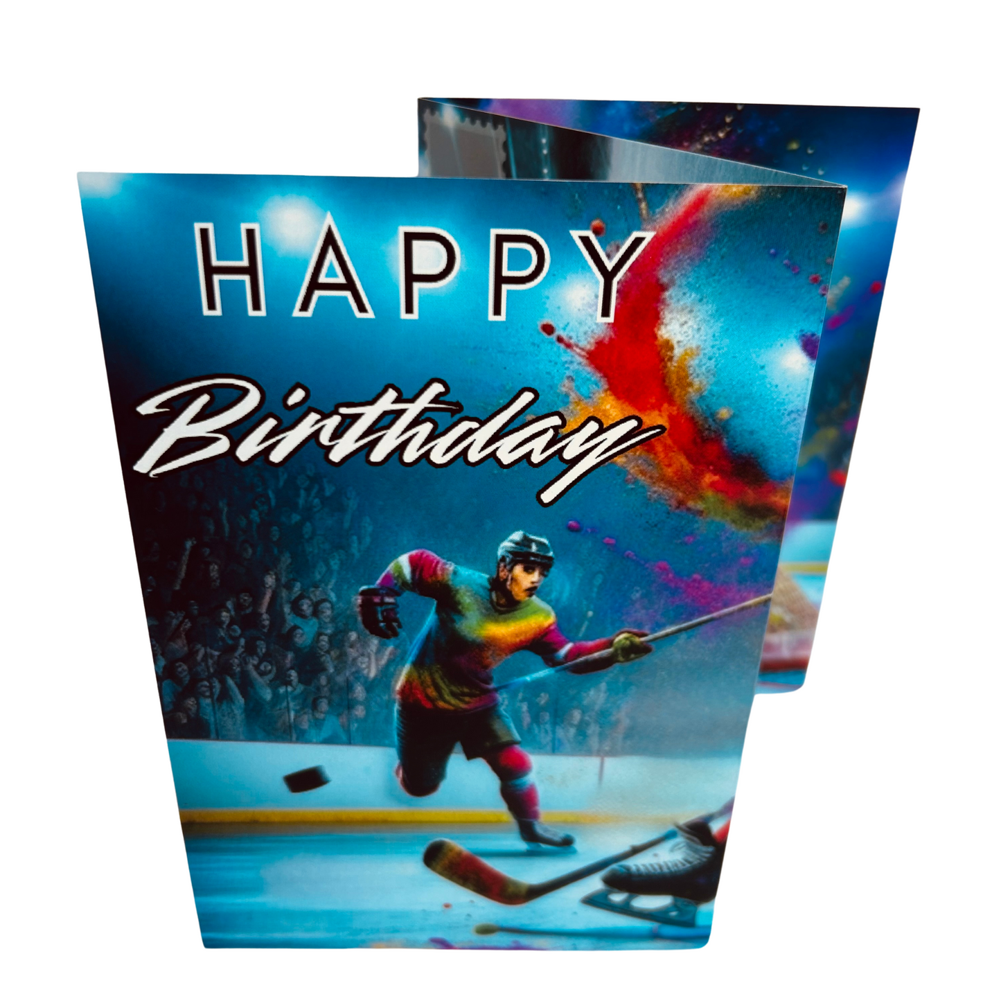 Trifold Ice Hockey Birthday Card from the Push the Limit Range. Image shows the folded card depicting front with ice hockey player in multicoloured strip races after the puck across the ice rink whilst the audience cheers him on  and a background of colouful paint splatters emerging from the top right. The caption reads 'Happy Birthday'.