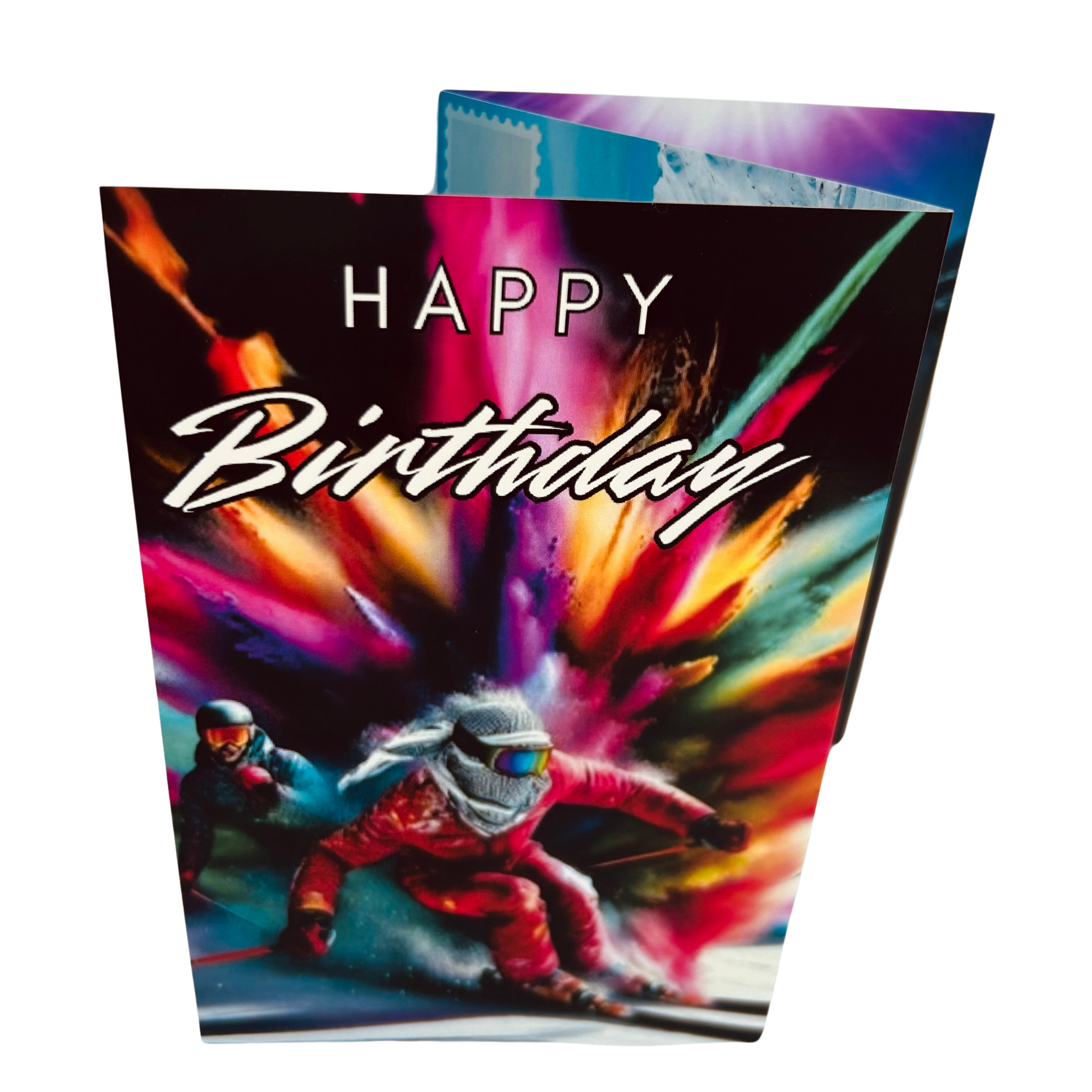 Trifold Skiing Birthday Card from the Push the Limit Range. Image shows the folded card depicting front with two skiers racing in full ski gear and goggles and a background of a vibrant colouful paint explosion. The caption reads 'Happy Birthday'.