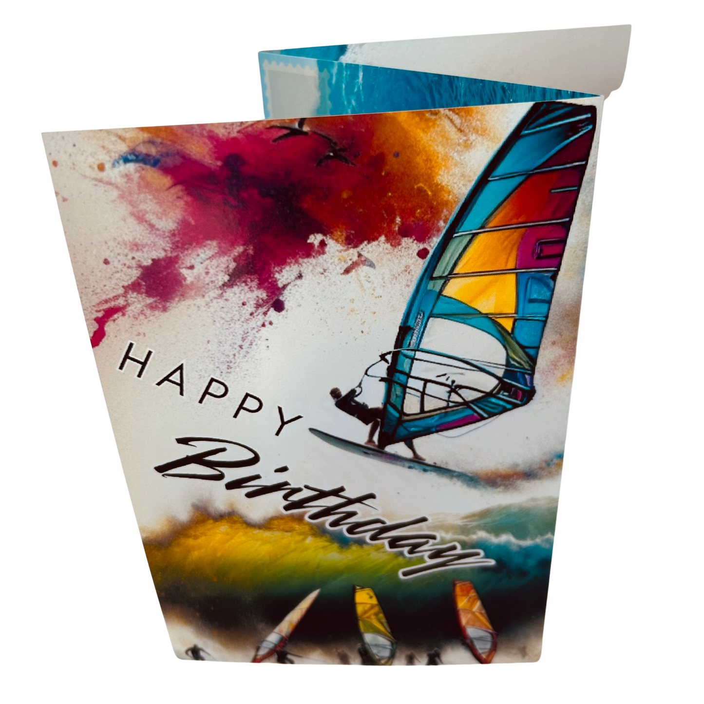 Trifold Windsurfing Birthday Card from the Push the Limit Range. Image shows the folded card depicting front with windsurfer jumping a wave on a background of colouful paint splatters whilst other windsurfers watch on with their boards and sails . The caption reads 'Happy Birthday'