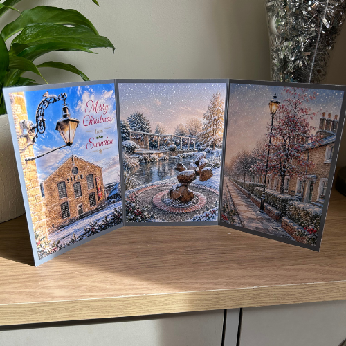 Bare Cards Triptych Christmas Card for Swindon, showing festive images of Steam Museum, Queen's Park, Christchurch and The Railway Village