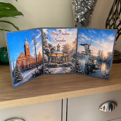 Bare Cards Self-sealing Christmas Card for Swindon, showing festive images of The Town Hall, the pavillion in Old Town Gardens and the diving board Coate Water.