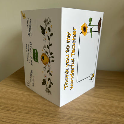 Bare Cards Thank you teacher card. Photo shows the built in envelope pages with the caption 'Thank you to my wonderful teacher' on the front with a space to write teacher name and images of a sunflower and a bee. On the back there is an image of a beehive with heart opening on a branch of white flowers. There is also the Bare Cards contact information and retail codes.