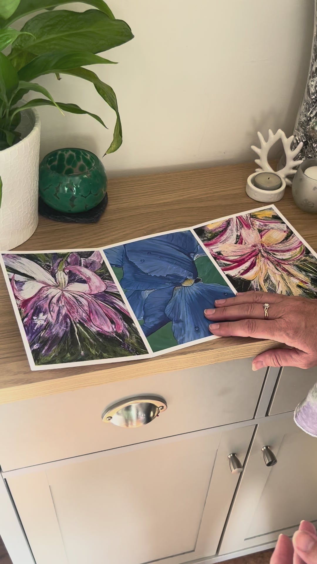 A demonstration video for the self-sealing greetings card 'Flowers' from the Sue O'Sullivan Art Collection. The video shows how to write, fold, seal, address, open and display this trifold card.
