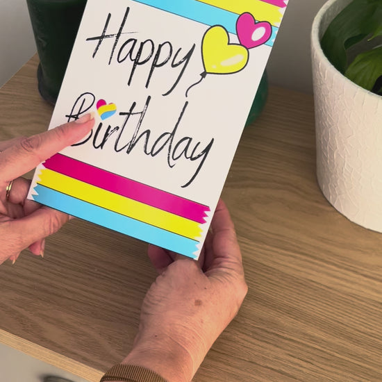 Video shows a demonstration of the Bare Cards Pansexual Birthday Card. Video shows how to fold and seal card to reveal built-in 'envelope' in Pride Flag colours.