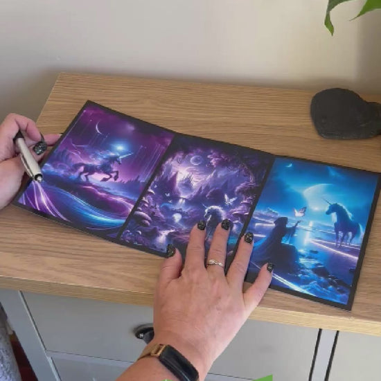 This video is a demonstration of how to use Bare Cards Portals of Wonder Cards which are a self-sealing range of cards that can be repurposed as Artwork to hang on your wall once enjoyed as a greetings card. The video shows how to write, fold, seal and display your card and finishes with it being displayed in a frame on the wall.