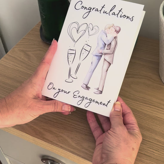 Video shows a demonstration of the Bare Cards Gay Engagement Card for men. Video shows how to fold and seal card to reveal built-in 'envelope'.