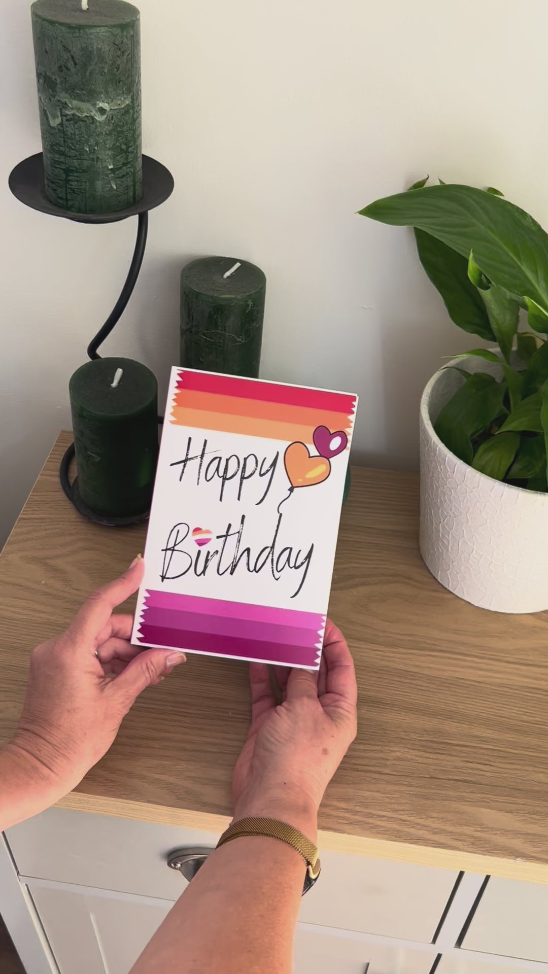 Video shows a demonstration of the Bare Cards Lesbian Birthday Card. Video shows how to fold and seal card to reveal built-in 'envelope' in Pride Flag colours.