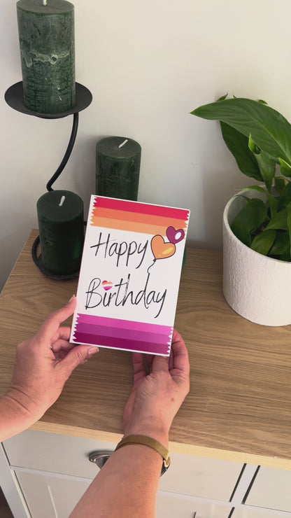Video shows a demonstration of the Bare Cards Lesbian Birthday Card. Video shows how to fold and seal card to reveal built-in 'envelope' in Pride Flag colours.
