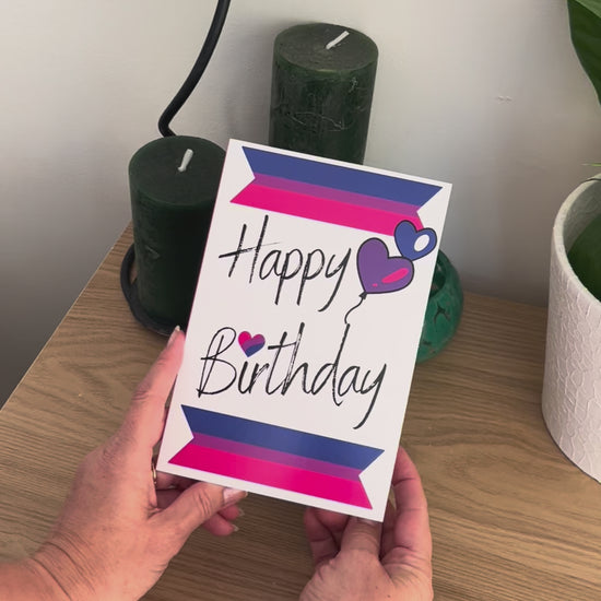 Video shows a demonstration of the Bare Cards Bisexual Birthday Card. Video shows how to fold and seal card to reveal built-in 'envelope' in Pride Flag colours.