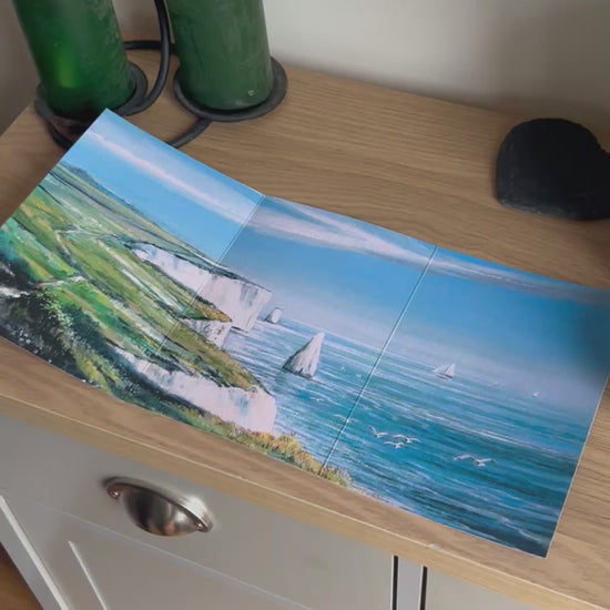 Video shows the self-sealing greetings card from Bare Cards from the John L Harris Collection - a trifold card showing paintings of British Coastal Scenes  - Ballard Down, Dorset. The Video shows how to fold, seal and write your card.
