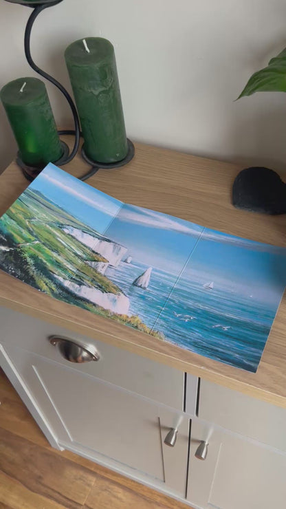 Video shows the self-sealing greetings card from Bare Cards from the John L Harris Collection - a trifold card showing paintings of British Coastal Scenes  - Ballard Down, Dorset. The Video shows how to fold, seal and write your card.