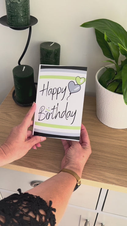 Video shows a demonstration of the Bare Cards Agender Birthday Card. Video shows how to fold and seal card to reveal built-in 'envelope' in Pride Flag colours.
