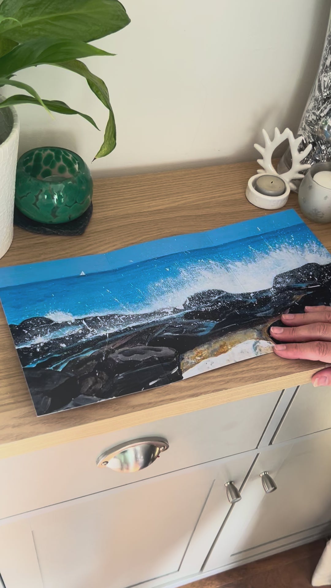 A demonstration video for the self-sealing greetings card 'Seascape on the Rocks' from the Sue O'Sullivan Art Collection. The video shows how to write, fold, seal, address, open and display this trifold card.